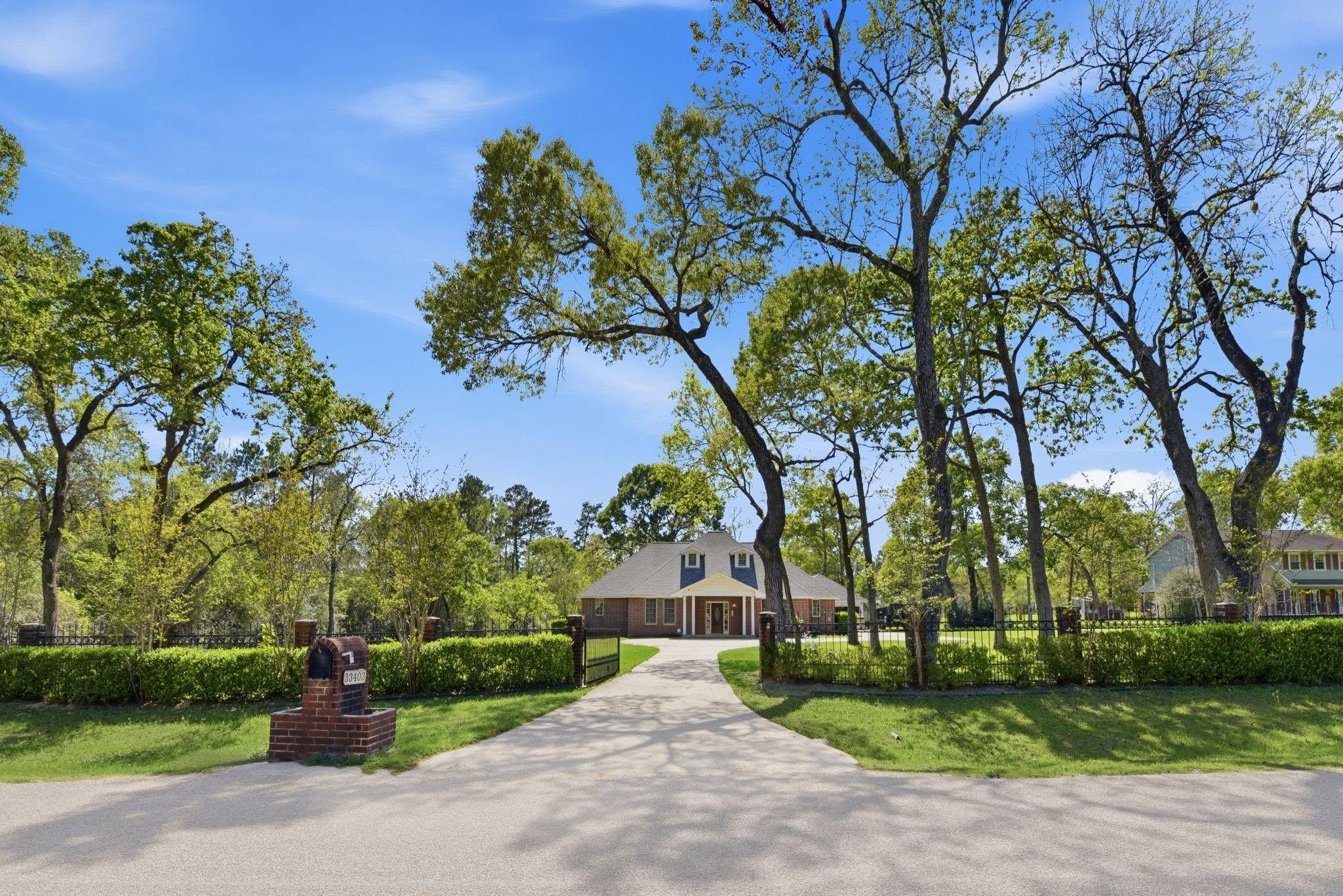 Stately brick estate home in greater Houston at golden hour